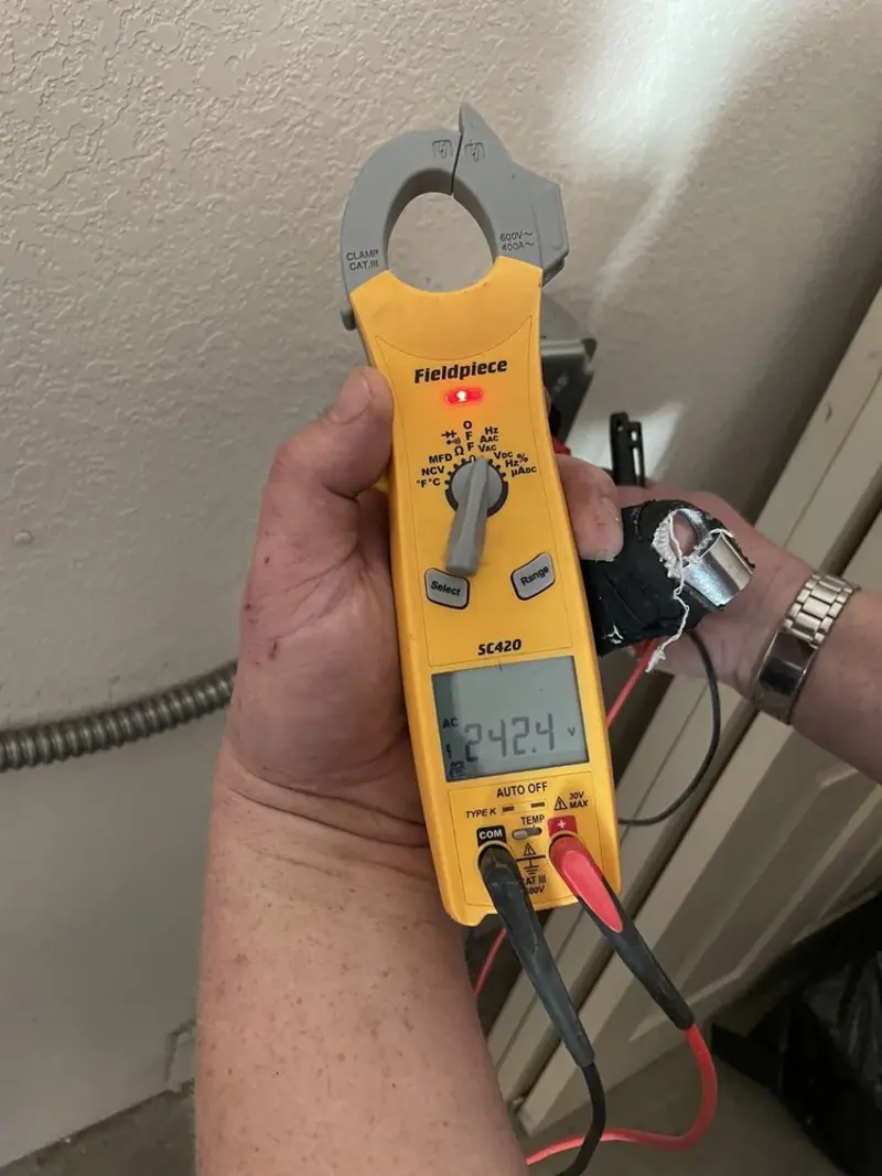 Voltage testing with clamp meter during Aluminum Wiring Replacement in Tucson Mountains